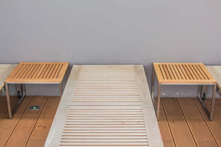 Seating and tables along the pool.の写真素材