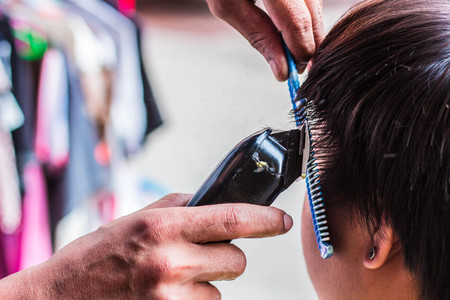 Now hand clippers haircuts for men.の写真素材