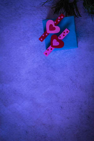 Heart and gift box on purple background.の写真素材