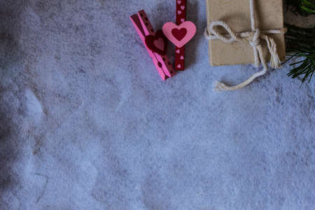 Pink hearts and a gift box on a white background.
