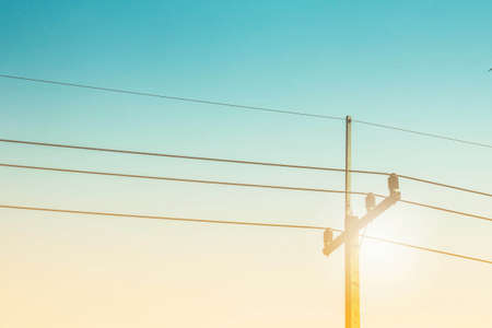 High voltage electricity pylon with the blue sky.の写真素材