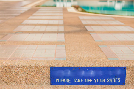 sign on the entrance stairs pool.