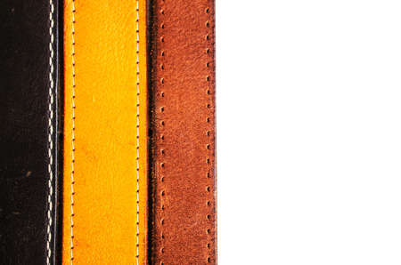 Leather belt arranged on a white backgrounds.の写真素材