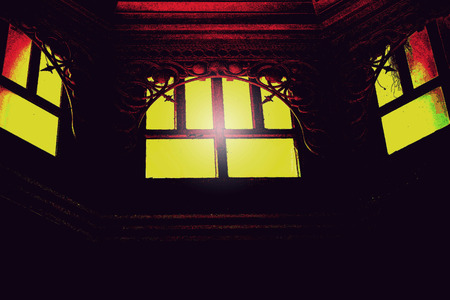 House window with a sleek black at night.の写真素材