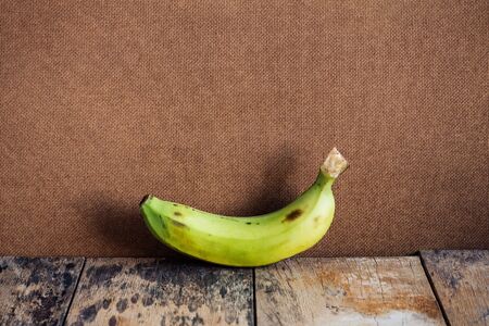 Ripe bananas on old wood.の写真素材
