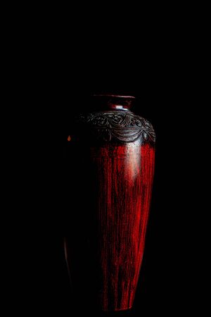 Ancient vase with a black background.の写真素材