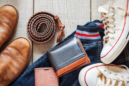 Clothing and accessories on the wooden floor.の写真素材