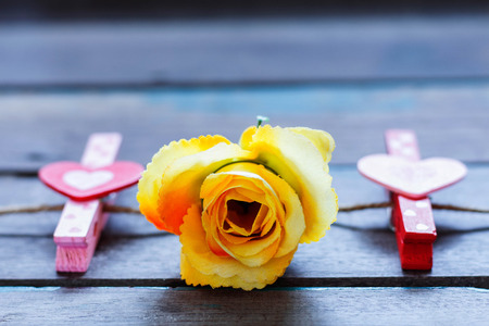 rose and heart on a wooden table.の写真素材