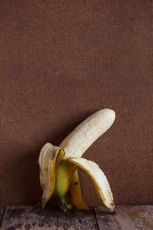 Ripe banana peel on the old wooden.の写真素材