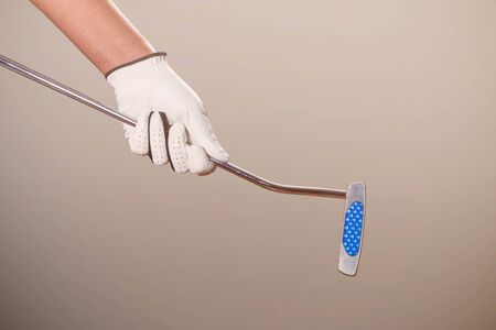 hands of man are holding golf.の写真素材