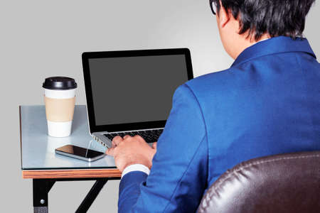 Businessman working on desk in office.の写真素材