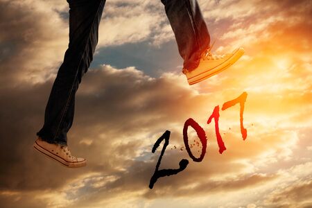 Feet jumping with obstacle crossing on the sky.の写真素材