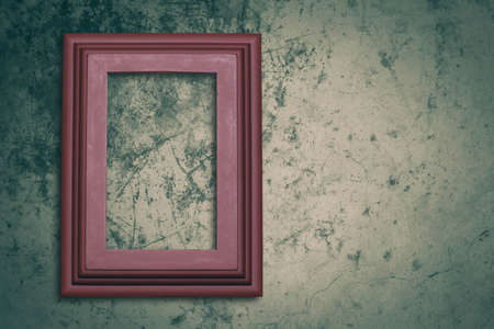 Old photo frame on concrete background.の写真素材