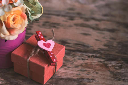 Heart and gift on the old wooden.の写真素材