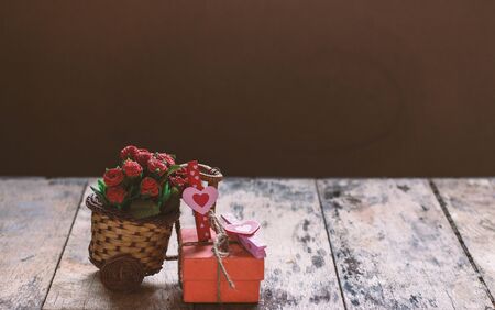 Heart and gift with flowers on the table.の写真素材