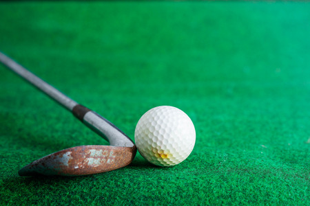 Old golf cart and rust on grass.の写真素材