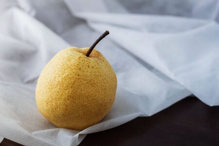 Pear on the tablecloth of background.の写真素材