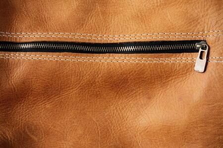 Zip and surface details of the leather bag.の写真素材