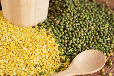 Soybeans and spoon on a sack.