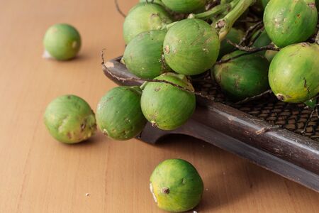 betel nut on a wooden tray.の写真素材