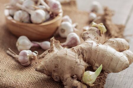 Ginger and garlic on sackcloth.