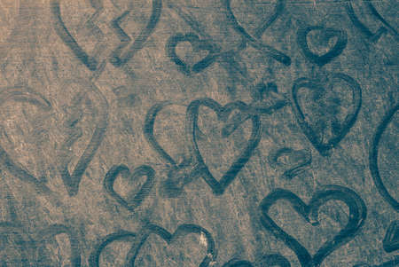 Heart on dusty of wooden floor.の写真素材