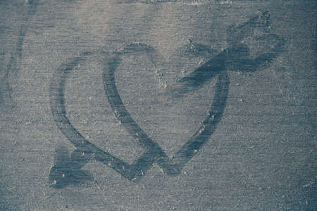 arrows of hearts on dusty wooden floor.の写真素材