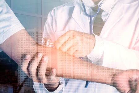 Doctor is checking the fever in the hospital.の写真素材