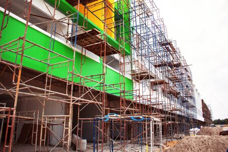 Old and rusty steel frame with a building project.の写真素材