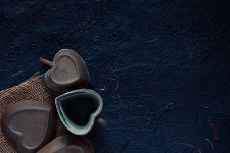 Old ceramic cup on a blue background.の写真素材