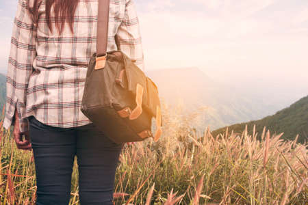 Young girl and bag with a nature trip.の写真素材