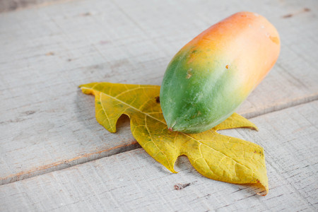 Papaya on the old wooden floor.の写真素材