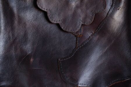 Surface seams and stitches of black leather.の写真素材
