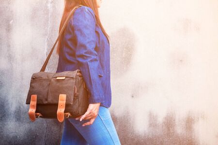 Women's fashion of jeans and handbags.