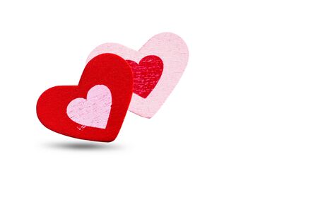 Red and pink hearts on a white background.の写真素材
