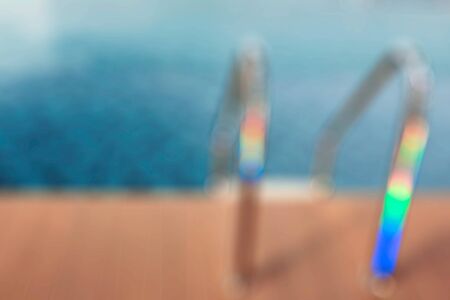 The railing of pool with blur image.の写真素材