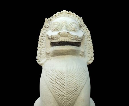 White lion statue with a black background.の写真素材