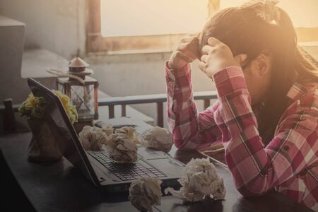 Asian women with stress at your desk.の写真素材