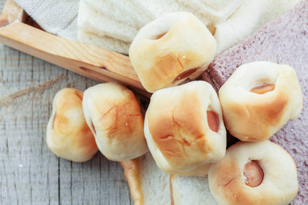 Bread filled on a wooden floor.の写真素材