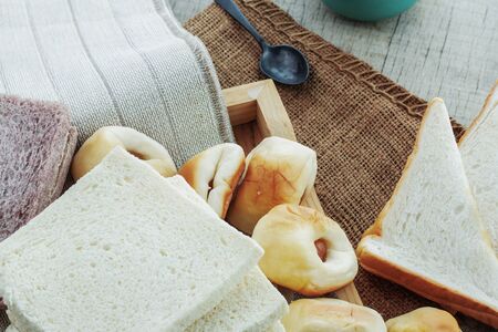 Many breads and coffee on tablecloths.の写真素材