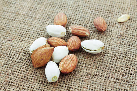 Many almonds on a sackcloth.の写真素材