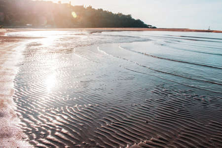Beach and waves at the sea in morning.の写真素材