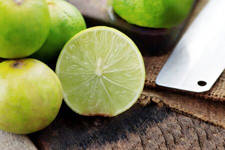 Lime of cut half on the old wooden floor.