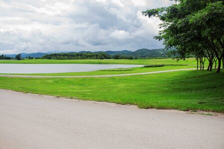 Roads and ponds in the park.の写真素材