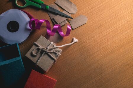 Gift boxes and equipment to make the wooden floor.の写真素材