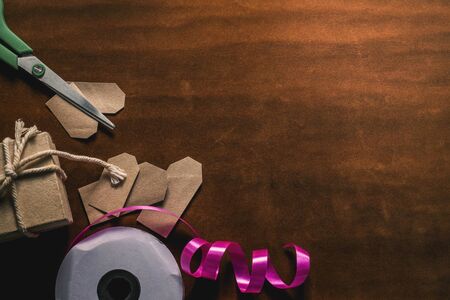 Ribbon and scissors with a gift on the floor.の写真素材