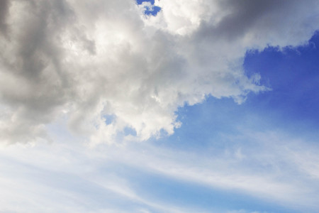 White clouds on the blue sky with background.