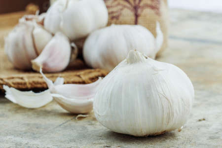 Dry Garlic on the old cement and sack.の写真素材