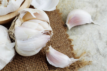 dried garlic on a sack with top view.の写真素材