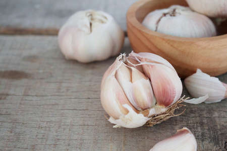 Dry garlic on wooden floor.の写真素材